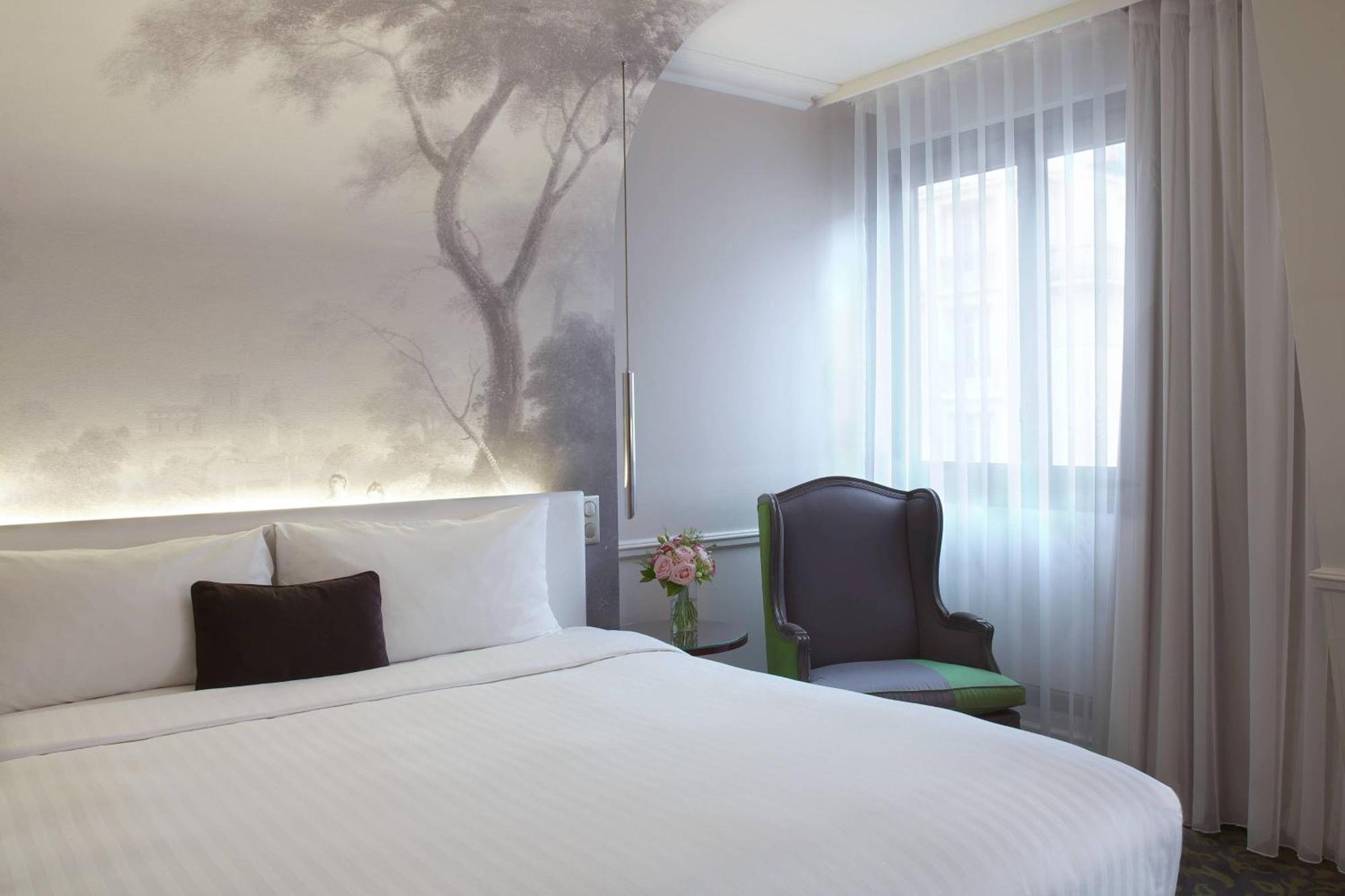 Habitación doble deluxe con cama grande y vistas al jardín