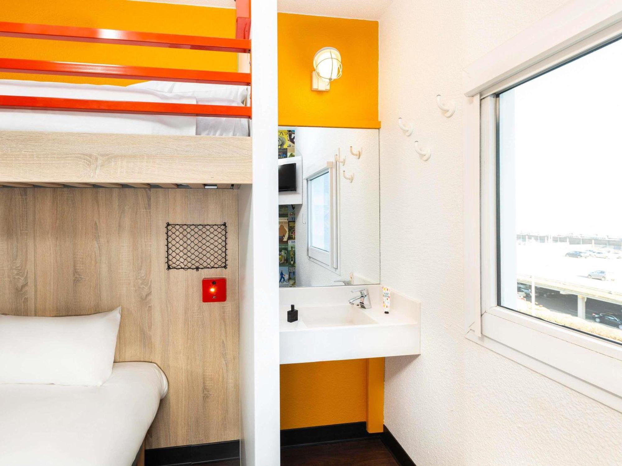 Break Room with Three Single Bunk Beds and Shared Bathroom