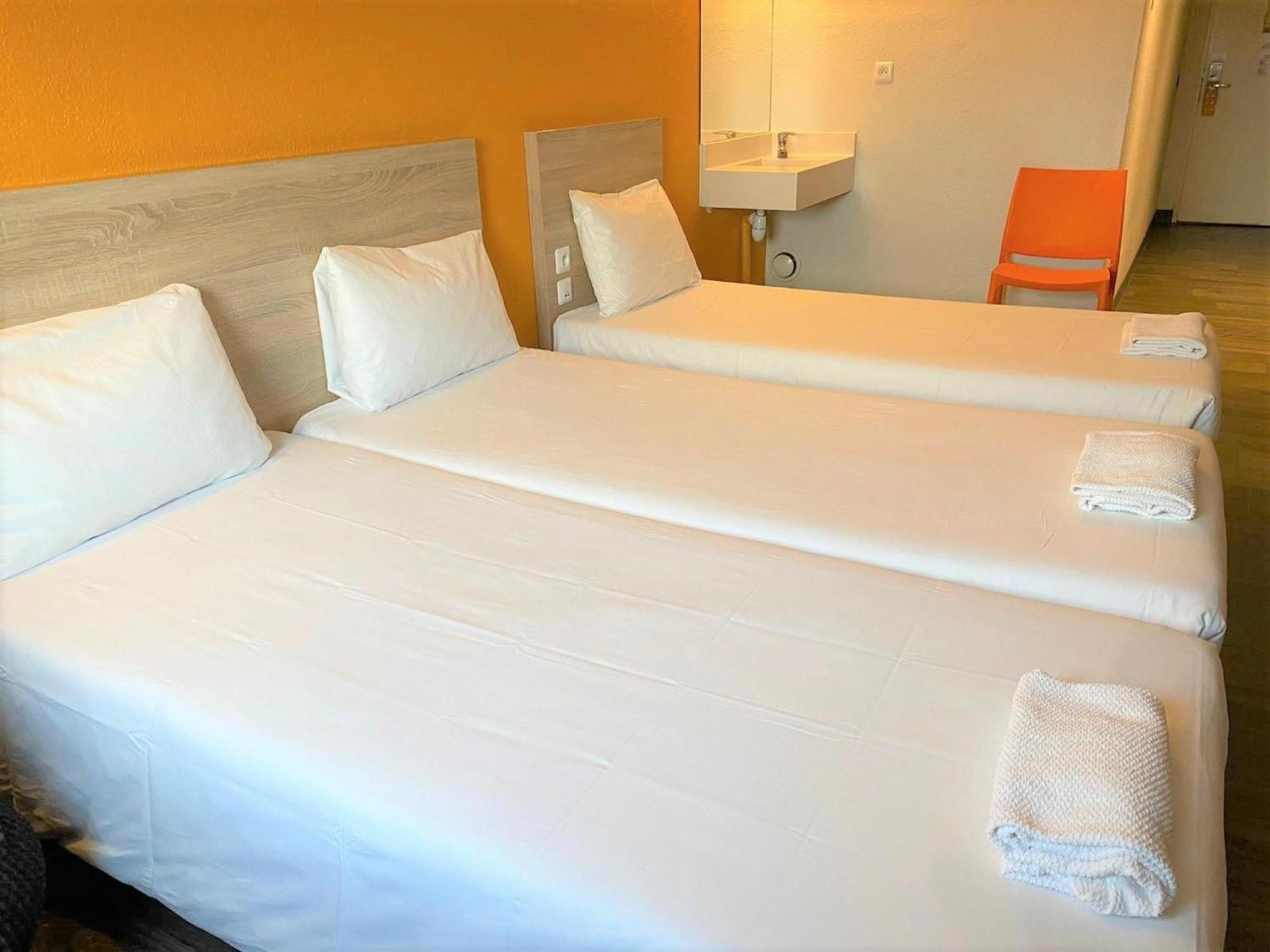 Habitación Break con 2 camas individuales y 1 cama supletoria