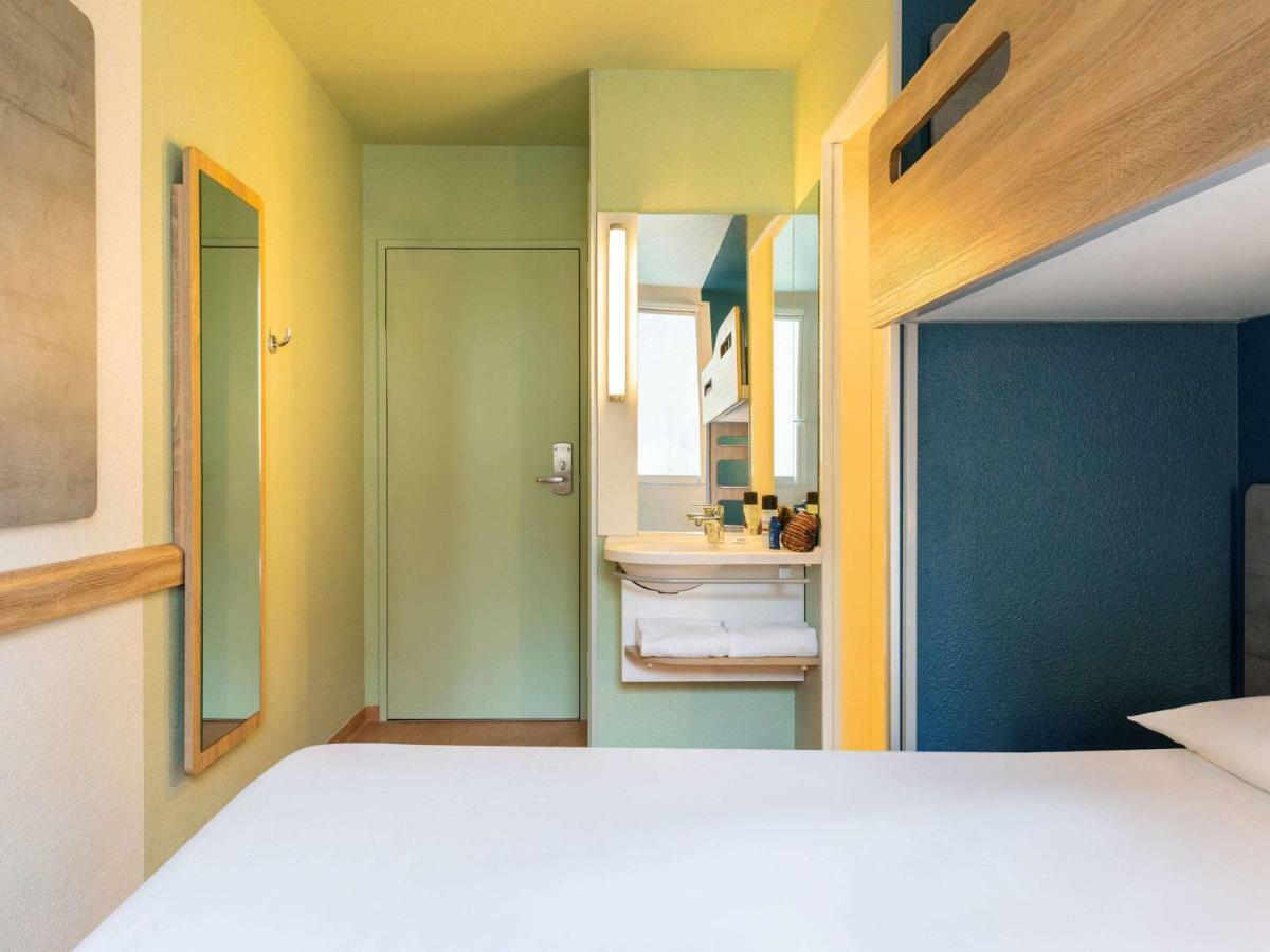 Room with One Queen Bed and One Bunk Bed